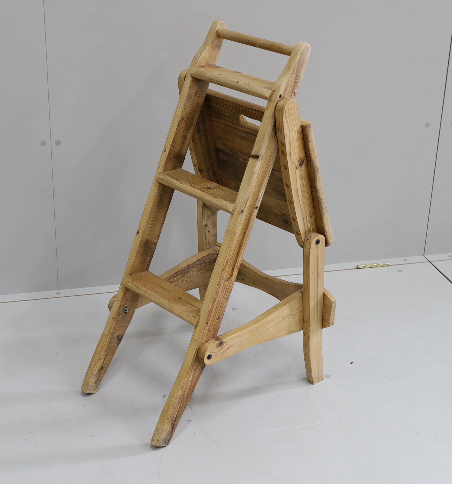 A provincial pine metamorphic library chair